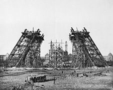 https://upload.wikimedia.org/wikipedia/commons/thumb/a/a0/Construction_tour_eiffel2.JPG/225px-Construction_tour_eiffel2.JPG